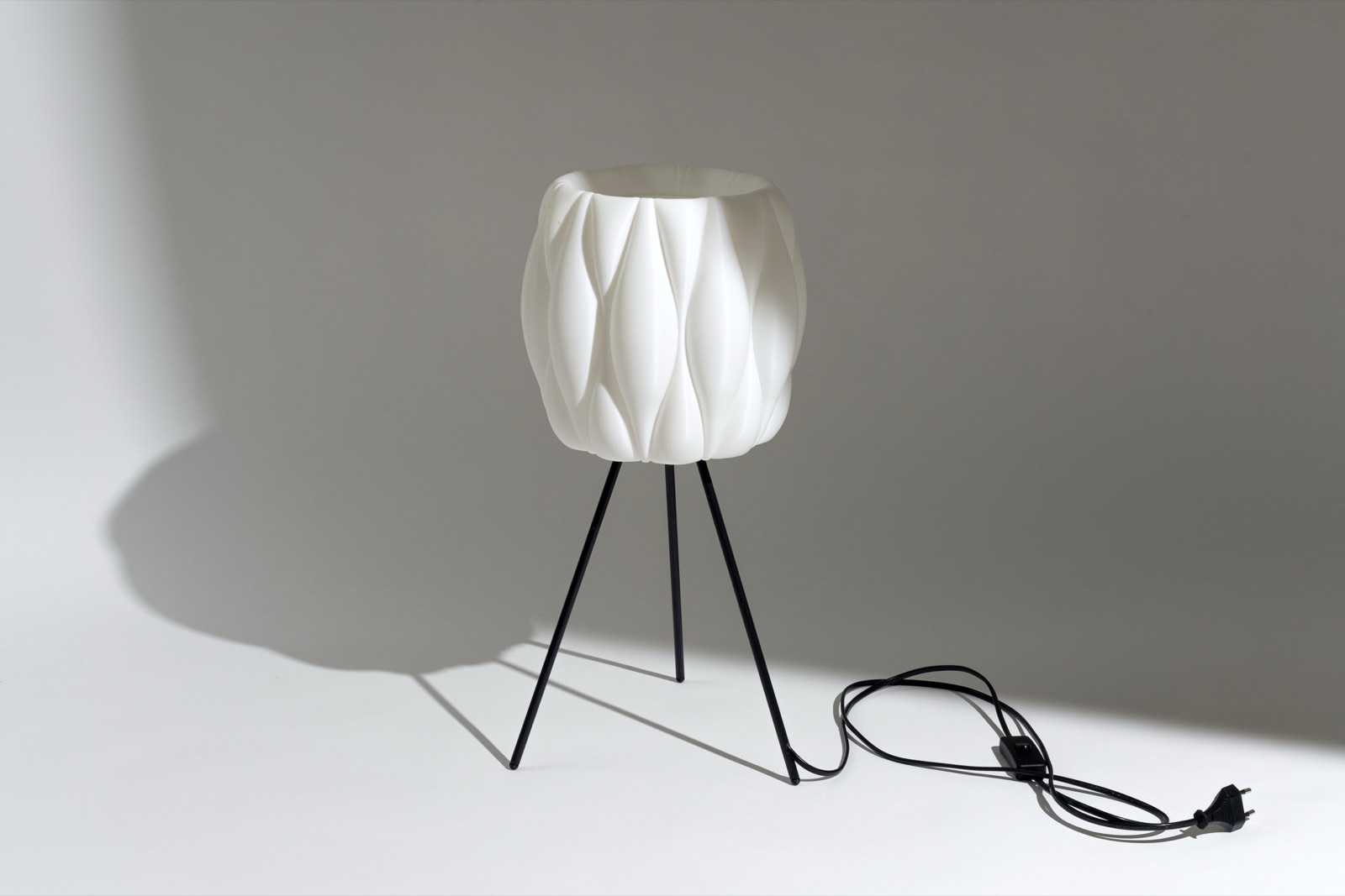 Collection of green 3D printed objects on a desk