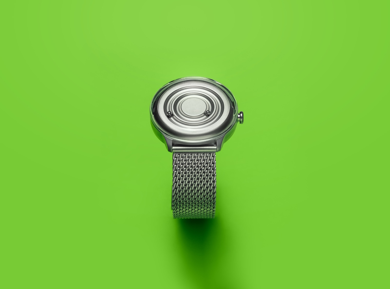 Silver ZIIIRO Jupiter watch on bright green