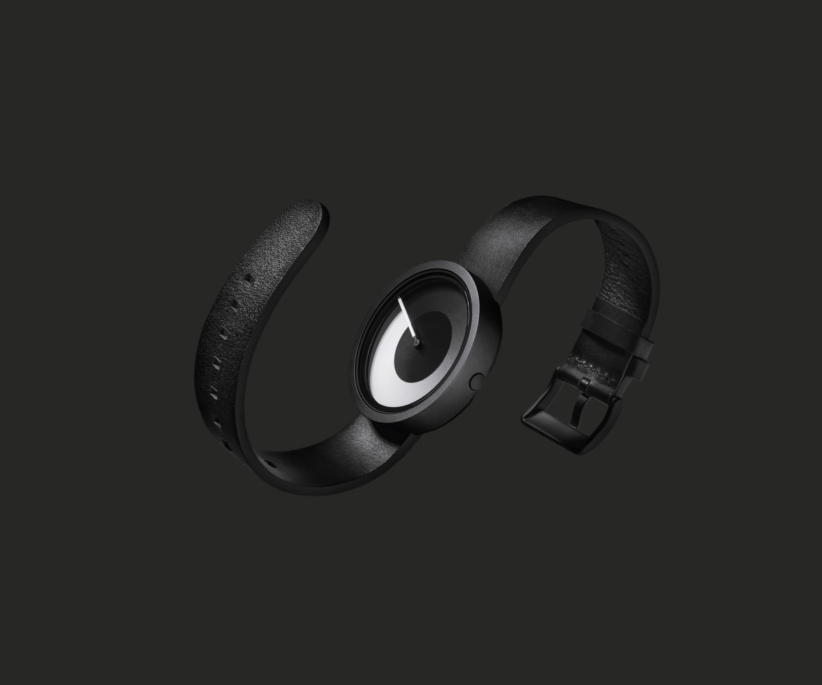 Black watch on a dark textured surface